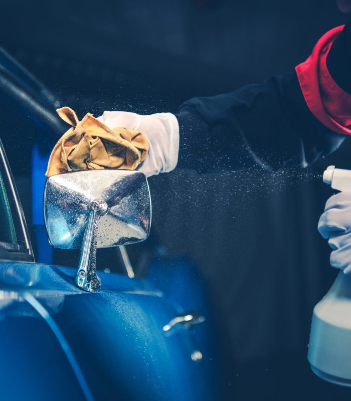 Blue American Classic Car Detailing Cleaning by Professional Worker.