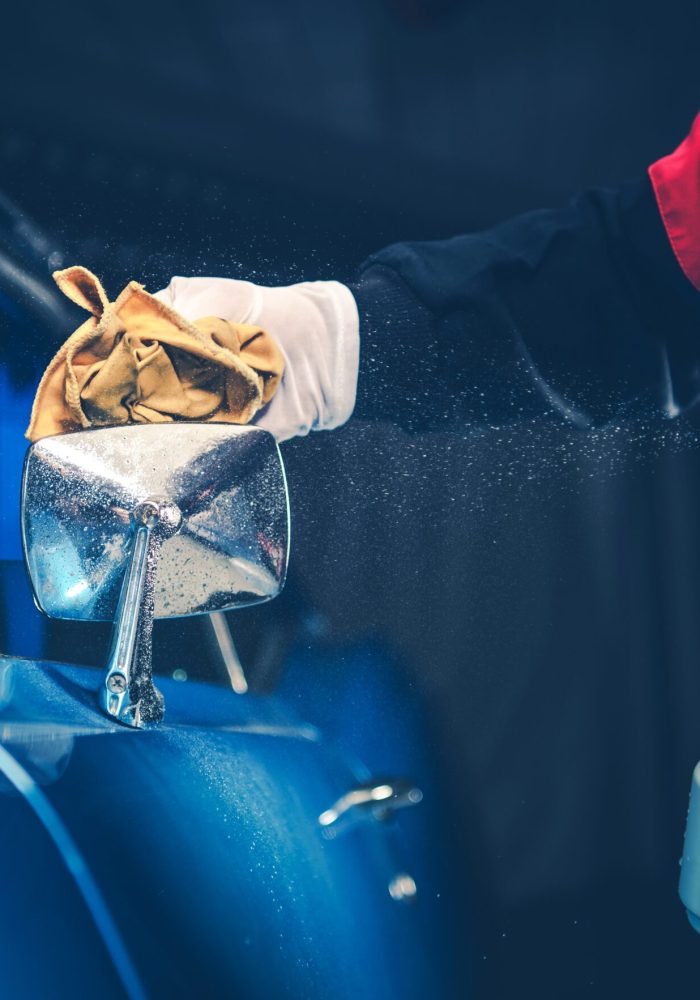 Blue American Classic Car Detailing Cleaning by Professional Worker.
